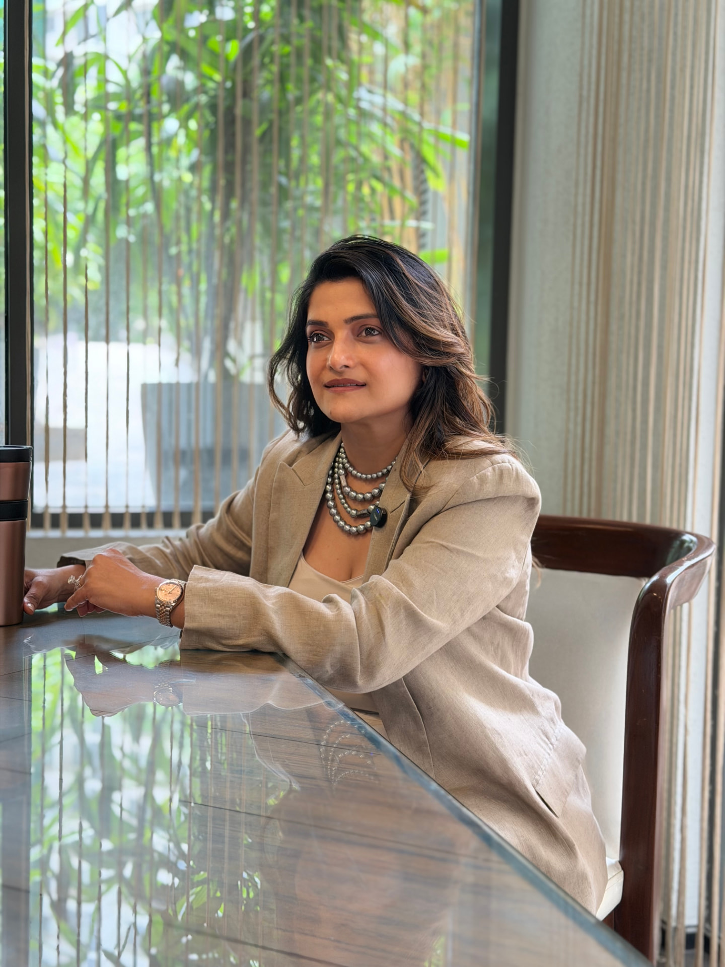 Ratnaa Mehta seated by a window