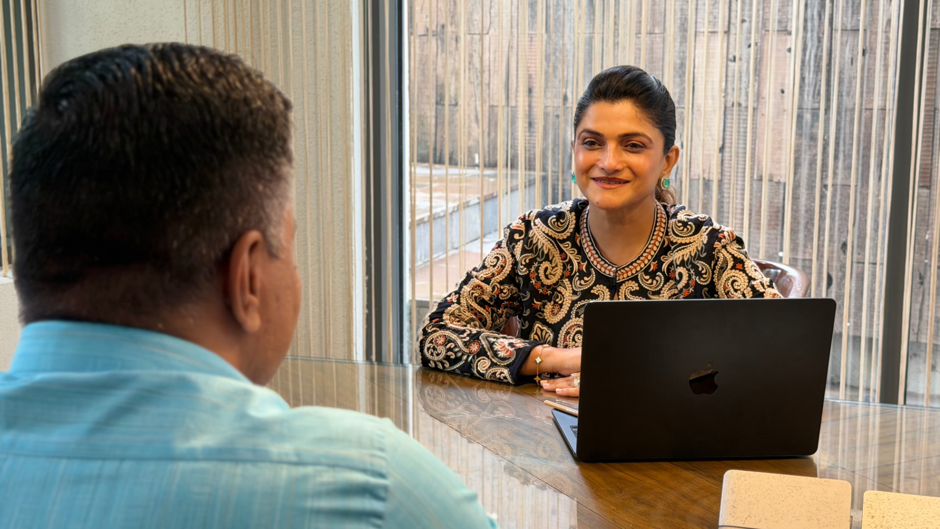 Ratnaa Mehta in consultation with a client